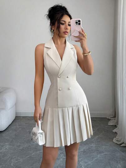 Elenzga Retaining The Lapel Collar Design Of A Suit, This Sleeveless Halter Neck Dress Features An Halterneck Silhouette. The Classic Double-Breasted Gold Button Detail Is A Signature Suit Element, Visually Cinching The Waist While Adding A Refined And Vintage Vibe. The Bottom Half Is Composed Of Neatly Pleated Ruffled Skirt, Suitable For Commuting, Dating, And Casual Occasions.