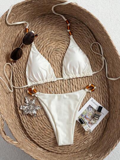 Swim SXY Bộ bikini 2 mảnh gợi cảm màu trơn, chất liệu cao cấp, hàng mới về mùa Xuân/Hè 2026, có đệm mút tháo rời, dây đeo vai tùy chỉnh, áo tam giác điểm nhấn nơ xinh xắn, quần tam giác buộc dây bên hông, đồ bơi đi biển thanh lịch và thoải mái.