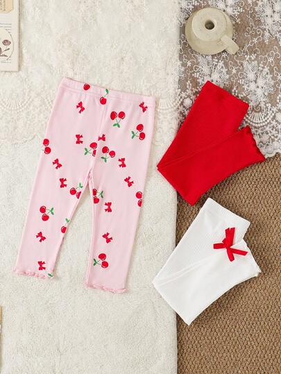 SHEIN Vintaside Kids Bộ 3 món quần áo mùa hè cho bé gái, thích hợp đi học, từ 6 tháng đến 3 tuổi, họa tiết nơ anh đào màu hồng dễ thương, nơ 3D màu trắng, quần legging cạp chun viền sóng màu đỏ, thoải mái và mềm mại, phù hợp cho các hoạt động ngoài trời mùa xuân và mùa hè.