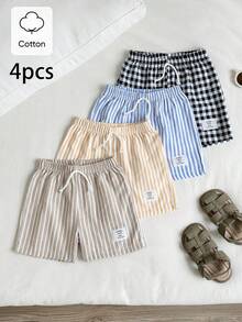 SHEIN Explorewe Bộ 4 món quần short thể thao thường ngày cho bé trai, phong cách đường phố, kẻ caro và sọc, phù hợp cho mặc hàng ngày, đi học, dã ngoại, thể thao, mùa xuân và mùa hè. Thiết kế đơn giản và thời trang, thoải mái khi mặc, mang đến nhiều lựa chọn phối đồ cho bé trai. Bộ trang phục này sẽ là lựa chọn sành điệu cho bé trai trong mùa hè, phù hợp cho kỳ nghỉ, chụp ảnh, xu hướng thời trang mới xuân/hè 2026. - Nhiều màu - Xem 8