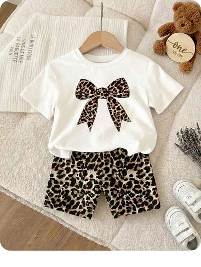 SHEIN Happikins Baby Girl Vintage Leopard Bow Style Casual Simple Round Neck Short Sleeve T-Shirt And Tight Shorts Set, Suitable For Spring/Summer