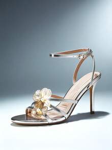 SHUZIA Women's Stiletto Heel Cushioned Insole 3D Metal Flowers Ankle Strap Metalic Pu Silver Dress Sandals – Elegant, Feminine & Event Ready - Silver - View 1