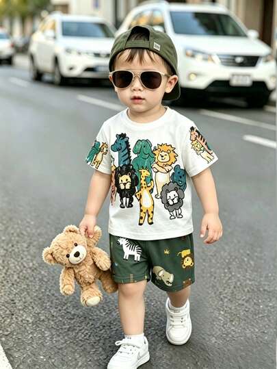 Set de 2 piezas para niños pequeños: Parte superior de manga corta suave con estampado de animales de dibujos animados adorables y shorts con estampado gráfico encantador, con patrones de jirafa, león y cebra. Conjunto casual cómodo, adecuado para fotografía, uso diario, salidas y regalos, para primavera y verano.