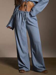 Athîral Denim Bộ đồ nữ gồm áo croptop tay cánh dơi buộc dây phía trước và quần jeans. - Rửa nhẹ - Xem 5