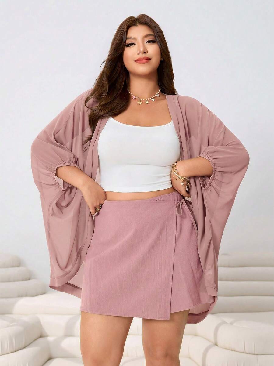 Solflare 三件套:宽松雪纺蝙蝠袖外套、弹力针织背心和舒适棉质短裙,适合休闲、派对、通勤、音乐节、返校、度假、街头穿搭等多种场合,灰绿色可选,大码尺码。 - 粉色 - 查看 1