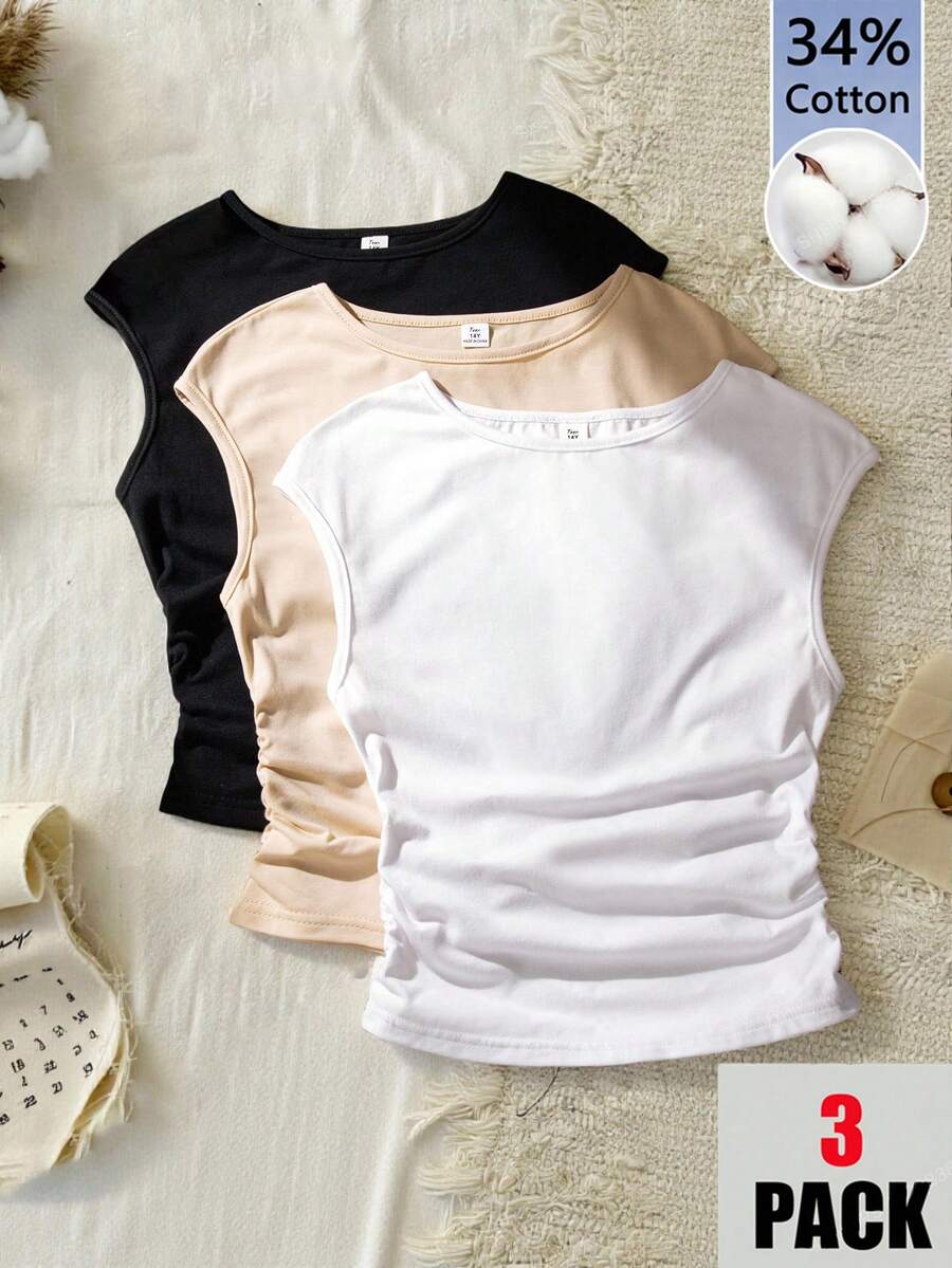 SHEIN Đây là bộ ba áo thun dành cho bé gái và thiếu niên. Áo có thiết kế cổ tròn, liền thân, vai rộng, không tay và kiểu dáng ôm sát với phần hông hơi nhăn. Những chiếc áo ngắn tay này rất tiện lợi cho các bé gái mặc hàng ngày vào mùa hè và dễ dàng phối hợp với các loại quần áo khác.