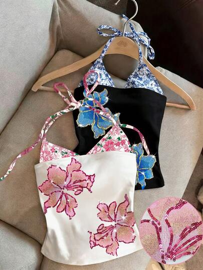 Glimmora Áo hai dây đính sequin và thêu này dành cho nữ có các chi tiết thêu và in tinh tế, thiết kế bền chắc và phong cách Y2K, hoàn hảo cho mùa hè. Thích hợp cho mặc hàng ngày, các lễ hội âm nhạc, tiệc tùng và kỳ nghỉ biển.