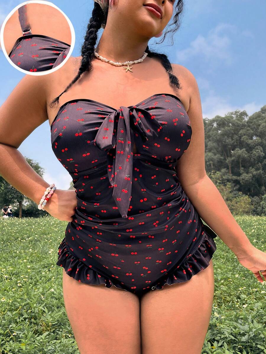 Swim Mod Bộ đồ bơi liền thân in kỹ thuật số tươi mới, mẫu mới về mùa Xuân/Hè 2026, có đệm ngực rời, thiết kế khoét rỗng, điểm nhấn nơ xinh xắn, kiểu áo quây gợi cảm, dây đeo bản rộng, viền bèo nhún, đồ bơi đi biển thanh lịch và thoải mái. - màu đen - Xem 1