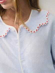 Nöista Striped Blouse With Floral Trim And Puff Sleeves For Summer Vacation And Casual Chic Looks. - Blue - View 6