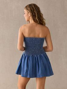 Đầm denim ngắn dáng xòe, không dây vai, thắt nơ phía trước. - Rửa trung bình - Xem 2