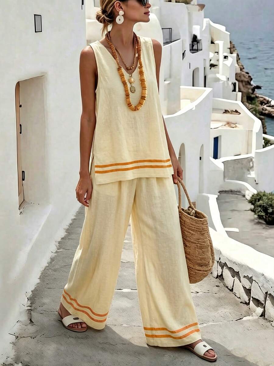 Hotletica Damen Lässig Urlaubs V-Ausschnitt ärmelloses Top mit Schlitz am Saum, kombiniert mit weiten gestreiften Hosen, modisches Outfit - Verschiedenfarbig - Übersicht 1