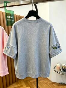 Franclia T-shirt ample et confortable pour femmes, imprimé de fleurs grises, de perles et de diamants, style unique pour les vacances d'été - Gris - Voir 2