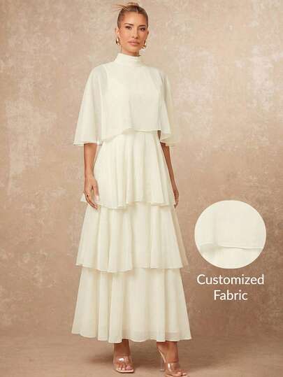 Lumalex Cream White Soft Pleated Textured Chiffon Tiered Maxi Dress With High Mock Neck Sheer Cape Overlay Flowing Flutter Sleeves Layered Ruffle Skirt A Line Silhouette And Elegant Airy Style, Summmer, Elegant Dress, Formal Graduation Wedding Evening Gown, Gala Night, Luxury Dress For Party, Elegant Casual Outfit, Weekend Outfit, Glamour Dress, Delicate Romance, Enchanted Romance Gown, Party Dress, Draped Dress, Layered Dress Tiered Dress Dress With Cape Dresses For Women Wedding