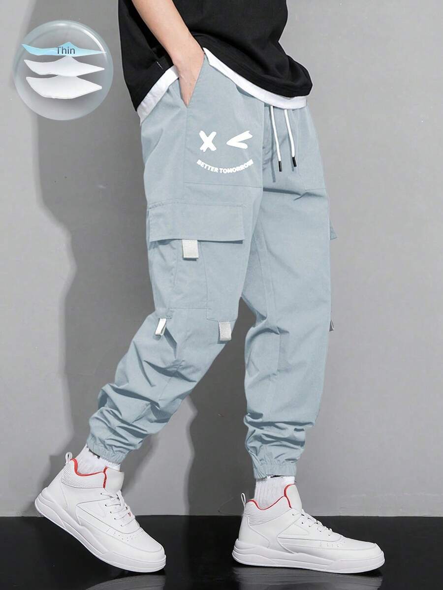 Manfinity Hypemode Loose Fit Men's Slogan Graphic Flap Pocket Drawstring Waist Cargo Pants - Baby Blue - View 1