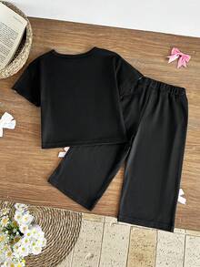 SHEIN 两件套女童夏季休闲甜美优雅街头风套装，黑色圆领T恤胸前饰有粉色蝴蝶结印花，搭配黑色长裤，适合上学和日常穿着。 - 黑色 - 查看 2
