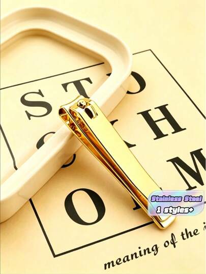 A Golden Carbon Steel Nail Clipper, Suitable For Travel, Portable And For Gift-Giving Or Personal Use.