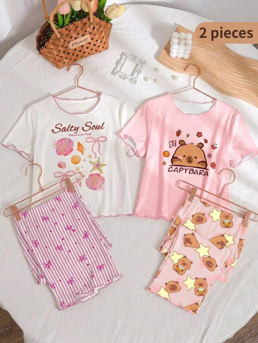 Genkimix Kids Bộ đồ ngủ cho bé gái tuổi teen, áo thun trắng in hình vỏ sò và nơ, viền ren hồng tương phản, kết hợp với quần ống rộng in họa tiết sọc và nơ, gấu quần xếp ly, đồ mặc nhà thoải mái. - Hồng - Xem 1