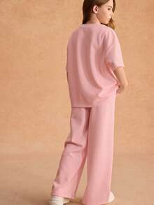 SHEIN Bộ áo thun rộng thùng thình + quần ống rộng cho bé gái tuổi teen. Chất liệu thoáng mát, màu hồng tươi tắn, thích hợp cho kỳ nghỉ và mặc thường ngày. - Màu Hồng baby - Xem 2