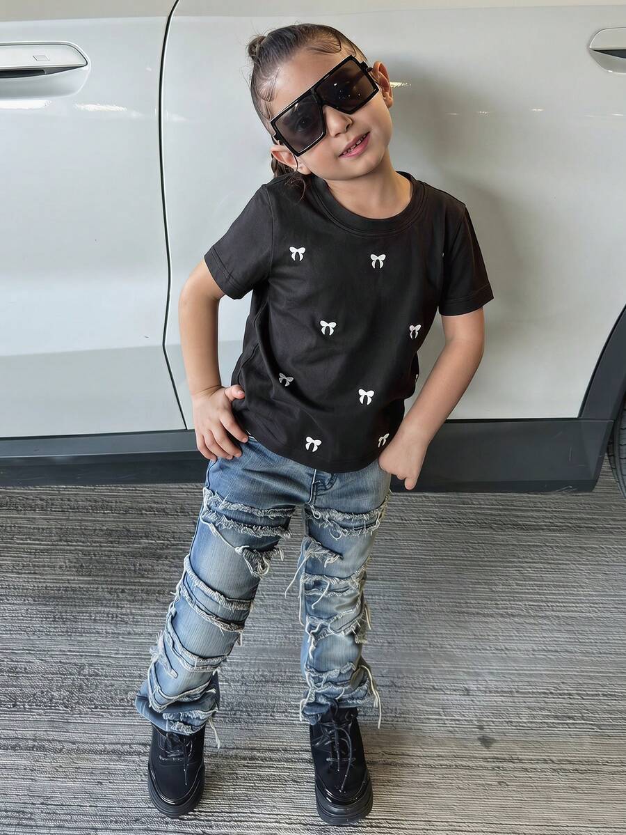 Dazy Kids Áo thun tay ngắn cơ bản cho bé gái (cỡ nhỏ) với họa tiết thêu nơ. - màu đen - Xem 1