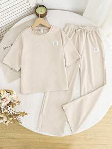 SHEIN 2 piezas Conjunto informal de camiseta de manga corta y pantalones de cuello redondo suelto y cómodo para niñas preadolescentes - Albaricoque - Ver 2