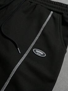 Manfinity Hypemode Bộ đồ nam thường ngày gồm áo thun ngắn tay in chữ và quần short. - màu đen - Xem 4