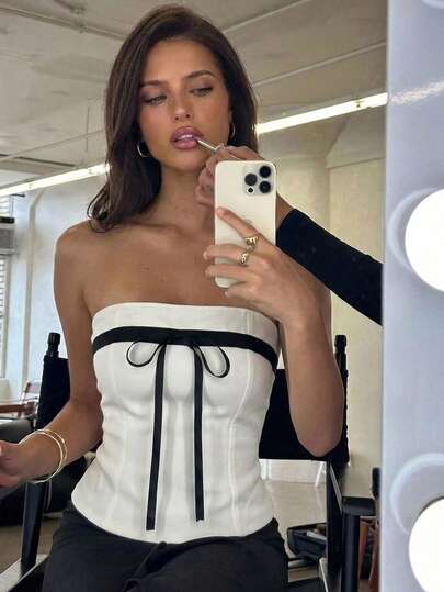 GlowEve Áo vest nữ mùa hè màu trắng trơn phối vải đen tương phản với nơ trang trí, hở lưng, không dây vai, thanh lịch, sang trọng, thích hợp làm quà sinh nhật, hẹn hò, dự tiệc, ngày Valentine, lễ hội, trang phục năng động, trang phục công sở, du lịch, nghỉ mát, đi biển, đường phố, chụp ảnh, thời trang mùa hè, áo hè, áo vest mùa hè, xu hướng thời trang mới, thiết kế độc đáo, hàng trăm kiểu dáng, áo vest nữ duyên dáng