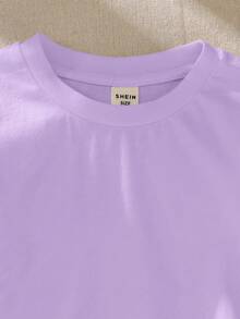SHEIN Camiseta casual holgada para niña con cuello redondo y dobladillo con volantes de unicolor - Morado - Ver 4