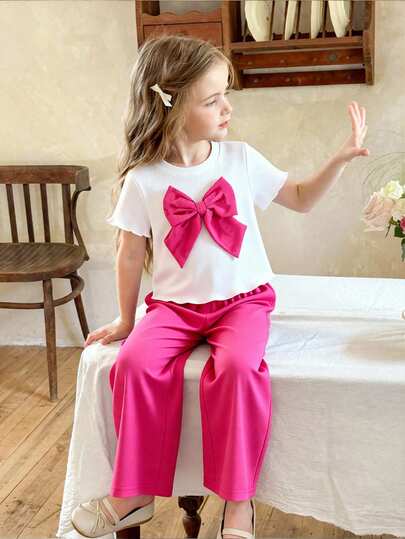 Conjunto casual de camiseta de manga corta con decoración de lazo y pantalones para niña bebé