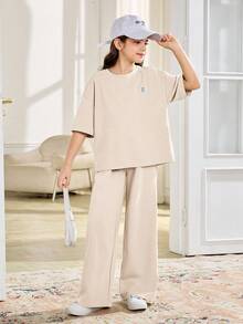SHEIN 2 piezas Conjunto informal de camiseta de manga corta y pantalones de cuello redondo suelto y cómodo para niñas preadolescentes - Albaricoque - Ver 7