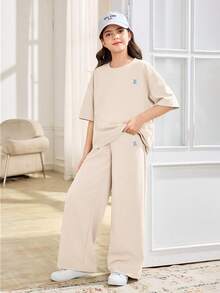 SHEIN 2 piezas Conjunto informal de camiseta de manga corta y pantalones de cuello redondo suelto y cómodo para niñas preadolescentes - Albaricoque - Ver 5