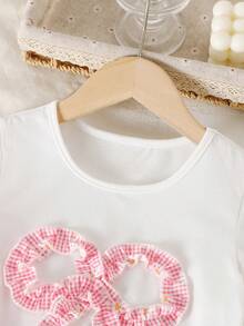SHEIN Playful Pals 2件組小女孩夏季7歲生日套裝，甜美蝴蝶結短袖T恤搭配雛菊格紋長褲，適合嬰幼兒的可愛休閒穿搭 - 粉色 - 查看 8