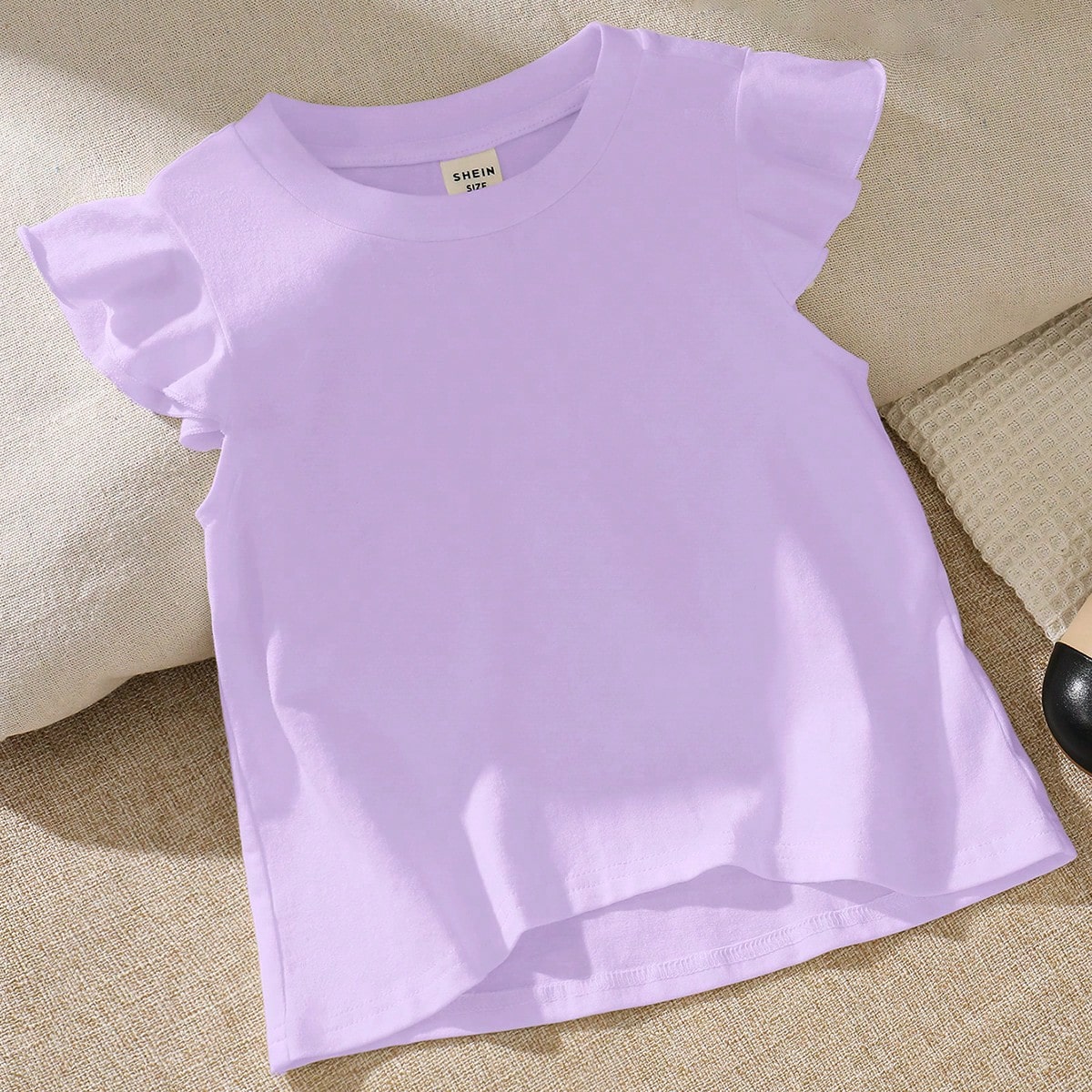 Camiseta casual holgada para niña con cuello redondo y dobladillo con volantes de unicolor