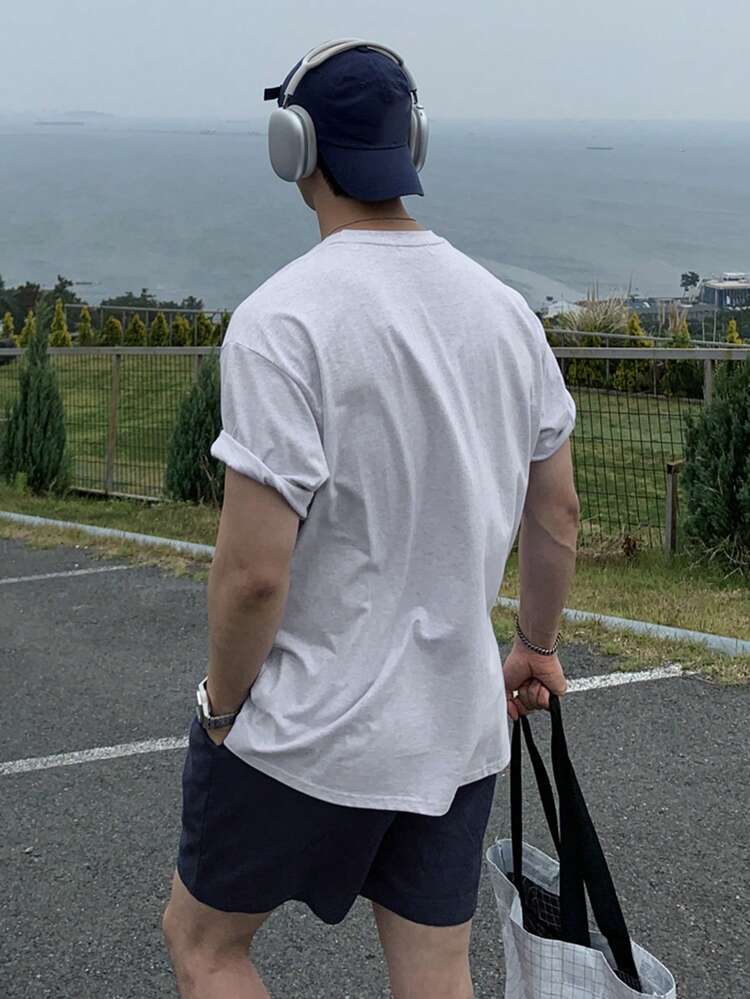 Men's Letter Print Round Neck Short Sleeve T-Shirt And Drawstring Waist Pocket Shorts Set