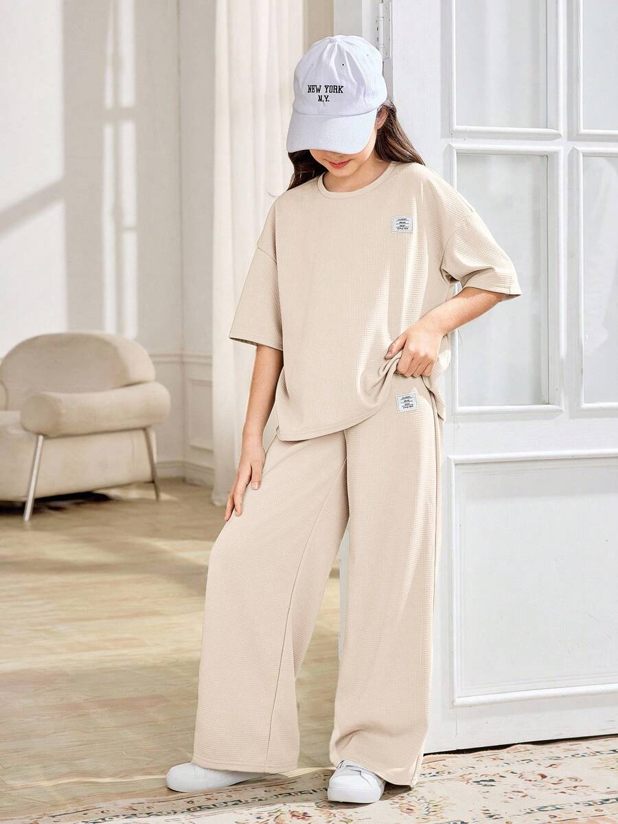 SHEIN 2 piezas Conjunto informal de camiseta de manga corta y pantalones de cuello redondo suelto y cómodo para niñas preadolescentes - Albaricoque - Ver 1