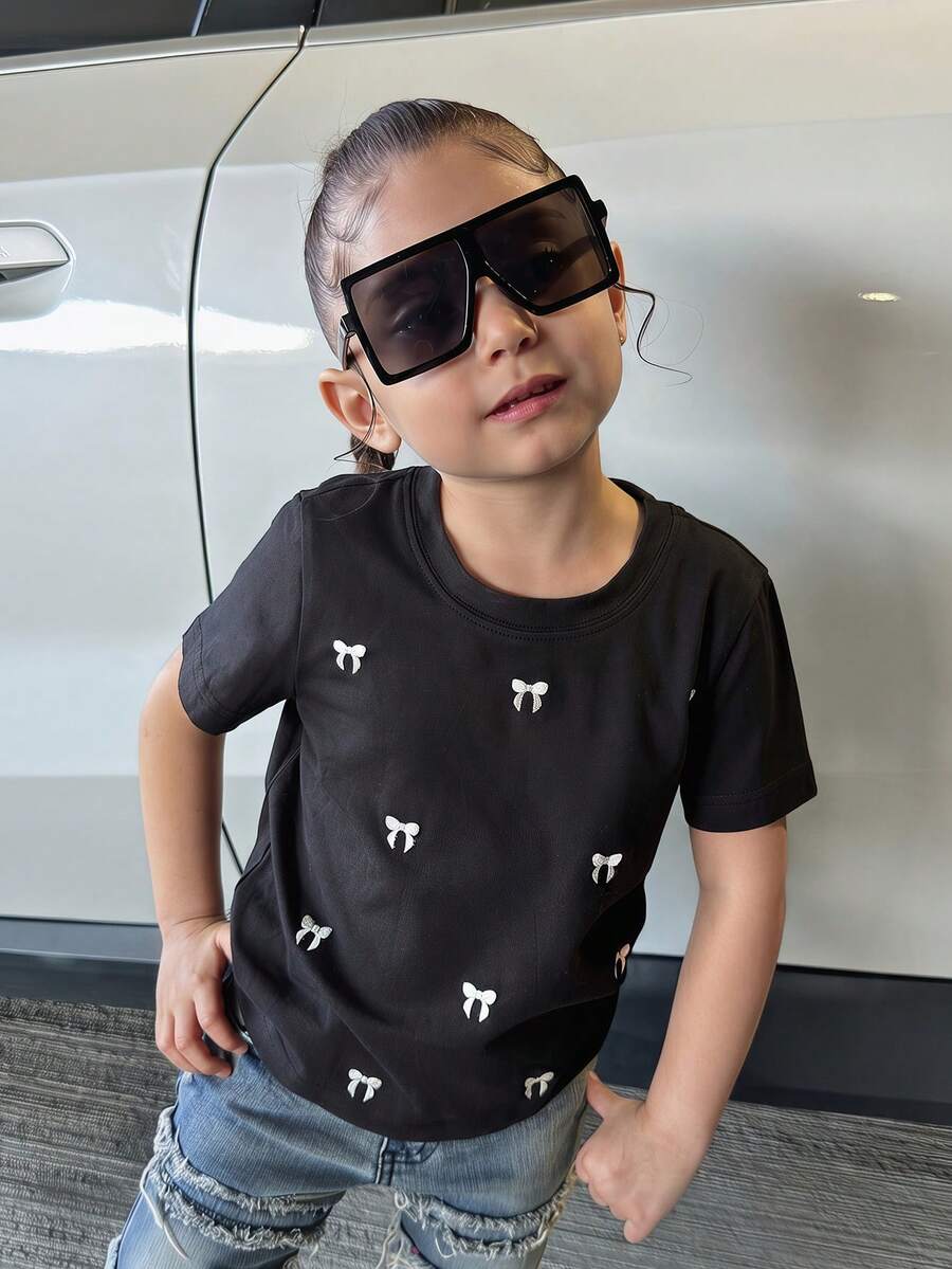 Dazy Kids Camiseta básica de manga corta para niñas (talla pequeña) con patrón de bordado de lazo - Negro - Ver 1