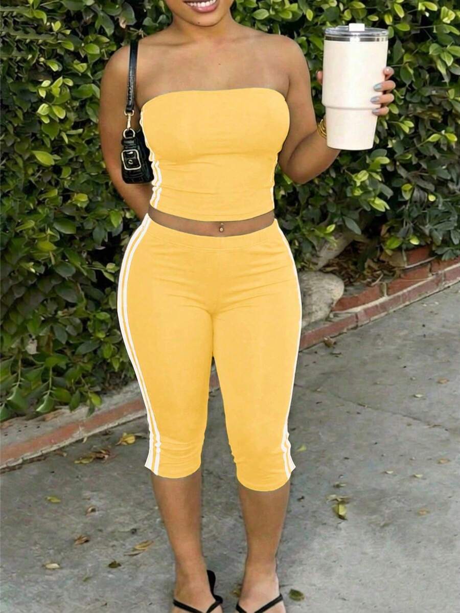 Slaydiva Bộ đồ nữ hai mảnh -A, thích hợp cho đầu xuân, lễ hội âm nhạc xuân hè, ngày lễ tình nhân, lễ Phục sinh, phong cách giản dị, cơ bản, đường phố Y2K ngọt ngào, sản phẩm bán chạy nhất của người nổi tiếng trên mạng, hẹn hò hàng ngày, phong cách cô gái nóng bỏng, gợi cảm và năng động, mùa tựu trường, áo quây không dây in khẩu hiệu, áo ba lỗ ngắn in tiếng Anh + quần ống rộng 7 inch, quần bó xẻ tà, trang trí dây đeo dệt màu tương phản bên hông, bộ màu xanh đậm. - Vàng nhạt - Xem 1