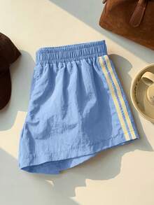 Comfortcana Quần short thể thao nữ màu xanh dương dáng ngắn, có viền sọc vàng bên hông, làm từ vải dệt trơn. - Màu xanh lam - Xem 5