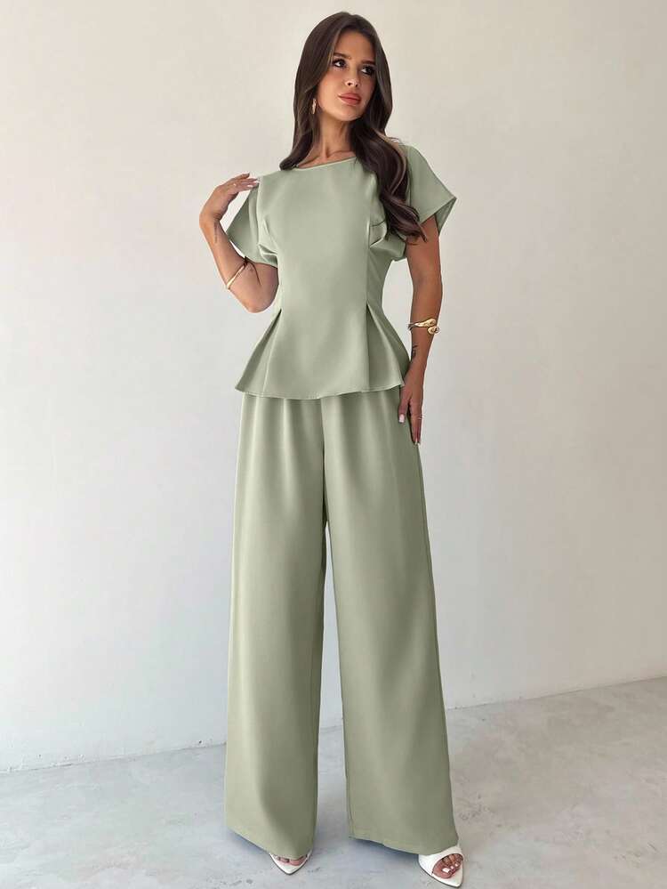 Firerie Bộ đồ nữ mùa hè đơn giản, thanh lịch, phong cách retro, thích hợp đi làm, đi nghỉ mát, tốt nghiệp, mặc hàng ngày, màu vàng mơ, chất liệu vải tre, cổ tròn, tay ngắn, xếp ly eo hình chữ X, áo sơ mi dáng suông và quần ống rộng. Bộ đồ này cũng thích hợp làm trang phục giáo viên, phong cách retro, trang phục công sở cho nữ, trang phục đi làm, trang phục sân bay, trang phục du lịch, trang phục đi chơi. - màu xanh lá - Xem 1