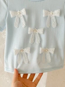 SHEIN LMoss Kids Áo thun bé gái dễ thương với nơ 3D, kiểu dáng thường ngày, đa năng, phù hợp cho mọi dịp. - Màu xanh nhạt - Xem 5