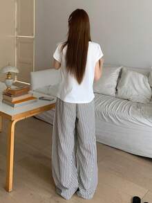 DAZY Bộ 2 món gồm áo thun ngắn tay in họa tiết và quần dài ống đứng kẻ sọc dành cho nữ, thích hợp mặc mùa hè. - trắng - Xem 2