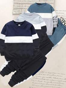 SHEIN 6件套小男孩休闲运动学院风三色拼接卫衣+裤子，适合日常穿着、上学、外出、运动、春秋季节。为小男孩提供多种搭配选择，增加服装组合的多样性。整体设计简洁大方，穿着舒适时尚。小男孩穿上这套衣服会感到舒适，展现出休闲时尚的造型。这套服装将成为小男孩衣橱中实用又时尚的选择。 - 彩色 - 查看 1