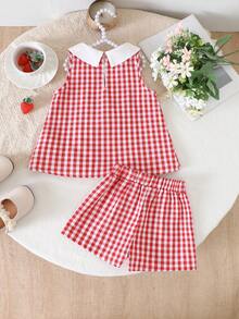 SHEIN Elladie kids 女童红白拼接草莓图案无袖上衣+短裤套装。经典的红白拼接梭织面料，白色彼得潘领饰以可爱的草莓图案，上衣采用修身褶皱设计。面料柔软舒适，搭配同色休闲短裤，适合打造可爱夏日造型，是派对、上学、度假、拍照的理想之选。兼具实用时尚、海岛风情、海滩周末休闲和夏季穿着的风格。 - 紅色 - 查看 2