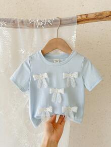 SHEIN LMoss Kids Áo thun bé gái dễ thương với nơ 3D, kiểu dáng thường ngày, đa năng, phù hợp cho mọi dịp. - Màu xanh nhạt - Xem 1
