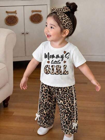SHEIN 2pcs/Set Baby Girls' Cute Style Letter & Leopard Print Patchwork Round Neck Short Sleeve T-Shirt And Bow Leopard Shorts Set, Loose Comfortable Fit, Suitable For Daily Outings, Campus Activities, Outdoor Play, Family Gatherings, Photo Shoots, Summer