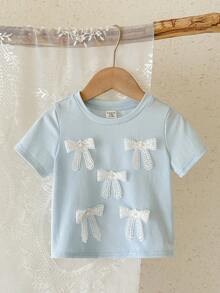 SHEIN LMoss Kids Áo thun bé gái dễ thương với nơ 3D, kiểu dáng thường ngày, đa năng, phù hợp cho mọi dịp. - Màu xanh nhạt - Xem 3
