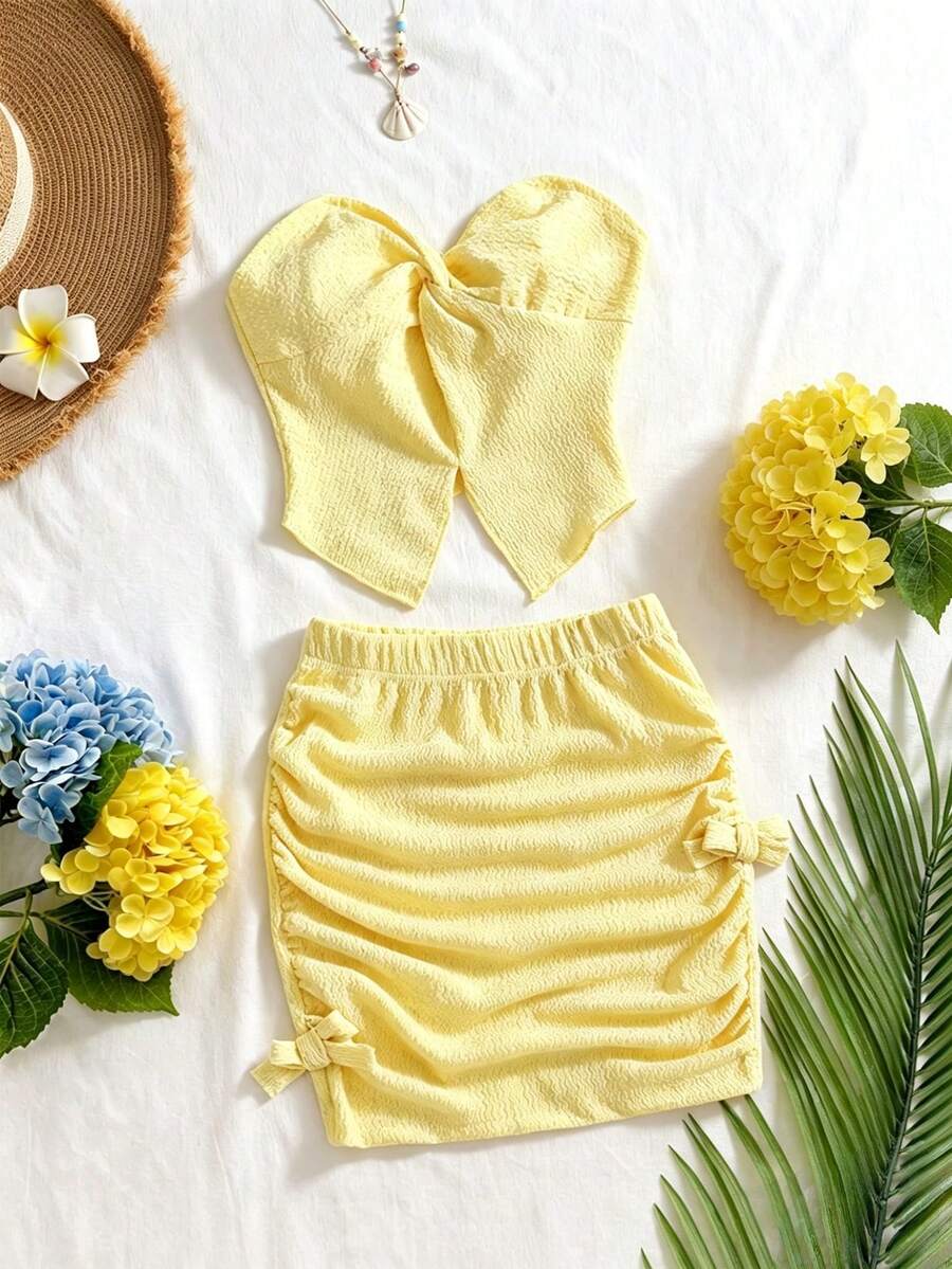 SHEIN Bộ áo hai dây xoắn phía trước và chân váy xếp ly thắt nơ dành cho bé gái tuổi teen, thích hợp cho kỳ nghỉ, đi chơi, du lịch và mặc hàng ngày vào mùa hè. - Màu vàng - Xem 1