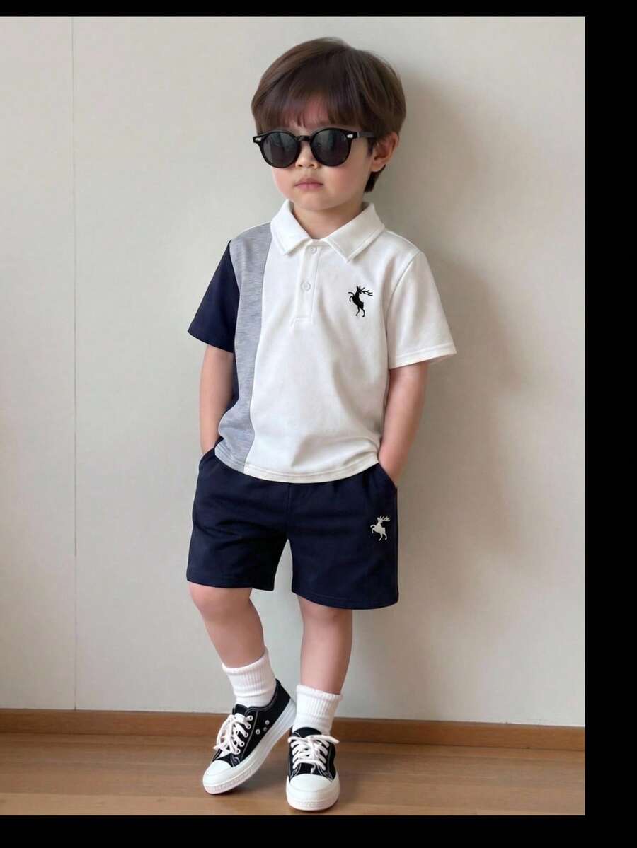 SHEIN Conjunto de 2 piezas para niño joven estilo casual suelto, camisa polo de punto y pantalon corto con cinturilla elástica y estampado de dibujo animado de animales - azul real - Ver 1