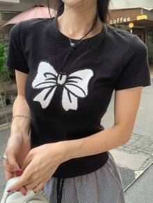 DAZY Camiseta casual de mujer de manga corta con cuello redondo y estampado de lazo - Negro - Ver 5