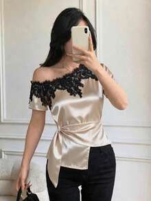 Celisse Áo kiểu satin màu mơ nhạt thanh lịch với đường viền cổ không đối xứng và viền ren. Chiếc áo thun tay ngắn, vạt áo không đối xứng này có phom dáng thon gọn và tôn dáng, là lựa chọn thời trang và đa năng cho cả công sở và thường ngày. Mùa hè - Rượu sâm banh - Xem 4
