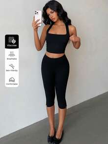 Flirla Set de 2 piezas de top corto de cuello alto informal y leggings con dobladillo dividido de ajuste ceñido, para todas las estaciones - Negro - Ver 1